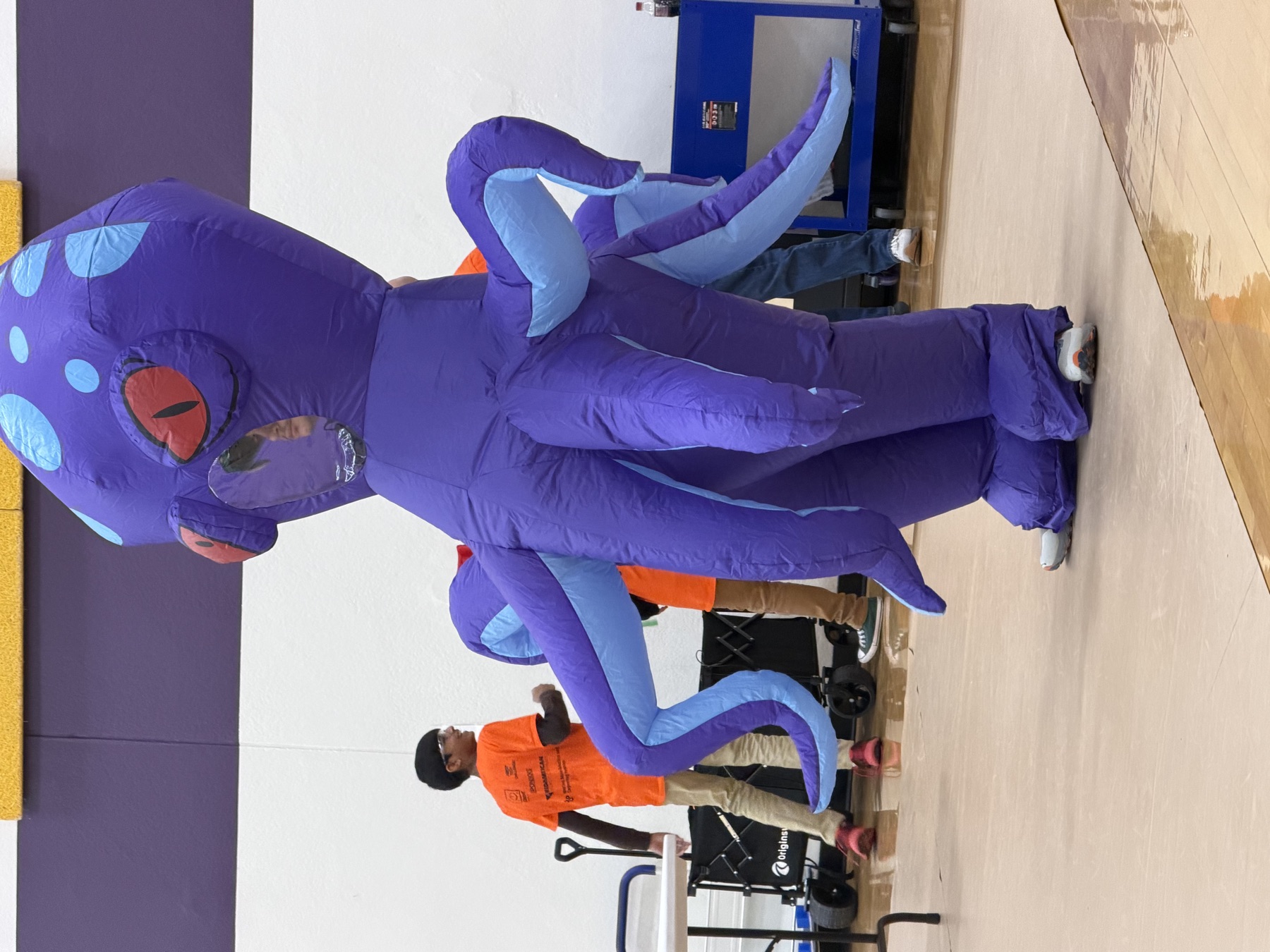 The Octobots inflatable octopus mascot at a community event
